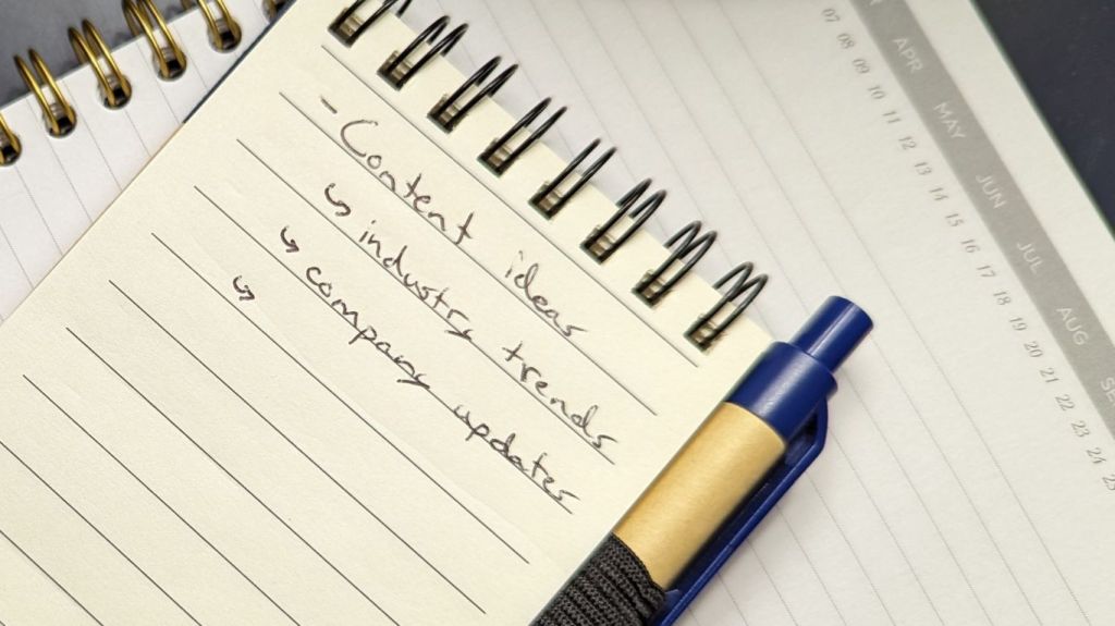 Notepad on a notebook that has content ideas written on it